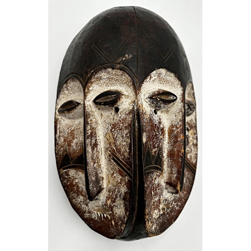 216 - Tribal interest - three Nigerian 'Joroba' carved twin faced masks, the largest 36 x 20cm