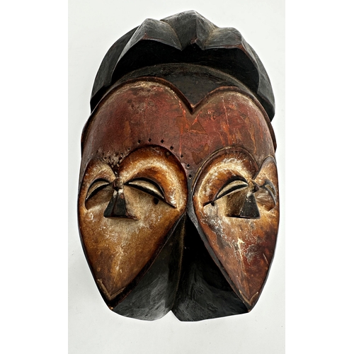 216 - Tribal interest - three Nigerian 'Joroba' carved twin faced masks, the largest 36 x 20cm