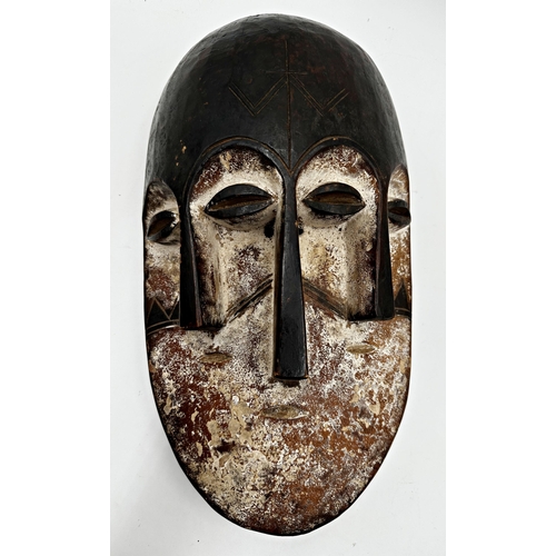 216 - Tribal interest - three Nigerian 'Joroba' carved twin faced masks, the largest 36 x 20cm