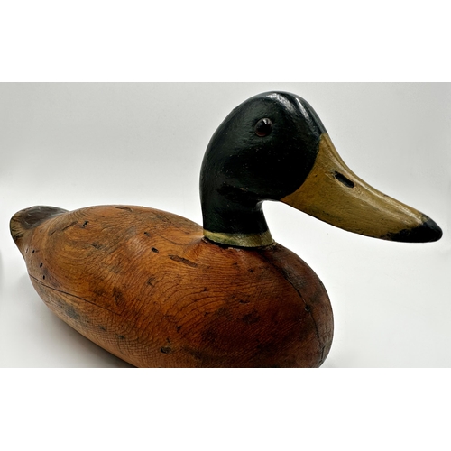 285 - Early 20th century American Folk Art decoy duck, with glass eyes and painted decoration, 'Mississipp... 