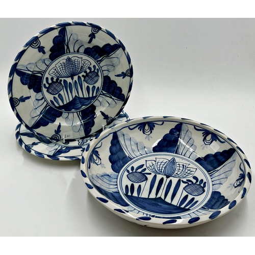 194 - Isis blue and white pottery, with expansive delft tulip decoration, fruit bowl and two plates (3)