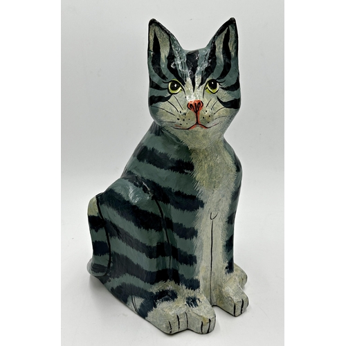 407 - Two large papier mache cats, a Siamese on a cushion, 26cm H x 41cm W, and a seated tabby 37cm high (... 