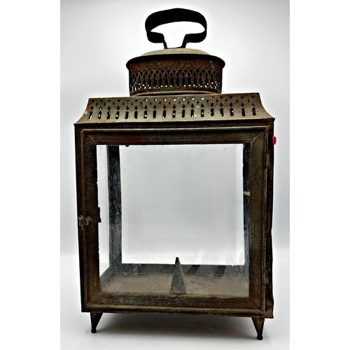 2190 - 19th century pierced sheet metal storm lantern with four glass panels, 45cm high