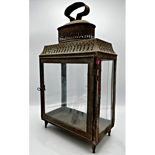 2190 - 19th century pierced sheet metal storm lantern with four glass panels, 45cm high