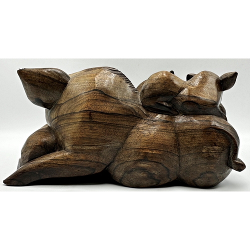 260 - Eastern hardwood carving of overlapping pigs, 13cm high x 25cm long