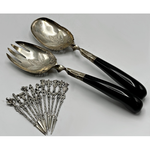 1225 - Pair of eastern '800' silver and horn salad servers, 26cm long with set on eleven African silver apo... 