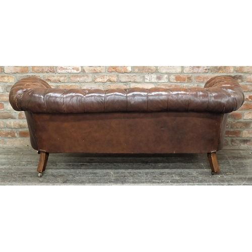 2369 - Victorian button back leather chesterfield sofa with ceramic castors, H 73cm x W 196cm x D 88cm