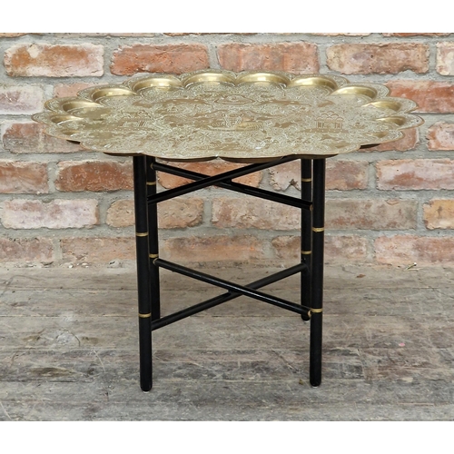 2396 - Indian engraved brass tray top table with folding ebonised stand, H 48.5cm x W 71cm