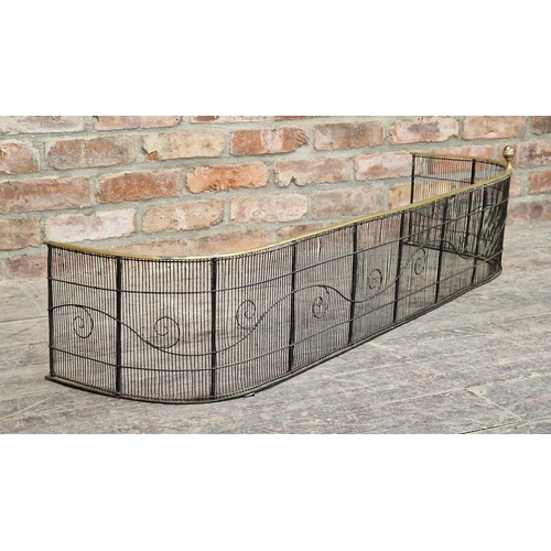 317 - Antique brass and wirework fire fender with scrolled detail, H 26cm x W 133cm x D 38cm