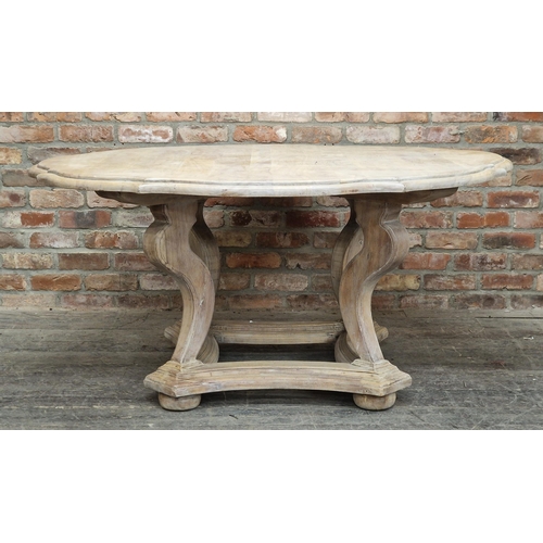 2403 - Contemporary limed oak dining table of serpentine form by Oka, raised on quadrupled base with sabre ... 