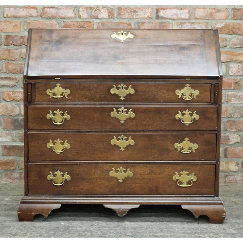 2404 - Georgian oak bureau with fall front, fitted interior, four graduated drawers, raised on bracket feet... 