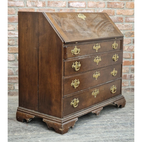 2404 - Georgian oak bureau with fall front, fitted interior, four graduated drawers, raised on bracket feet... 