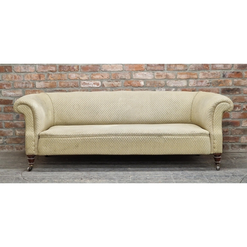 2407 - 19th century upholstered chesterfield sofa with scrolled arms, raised on turned legs with ceramic ca... 