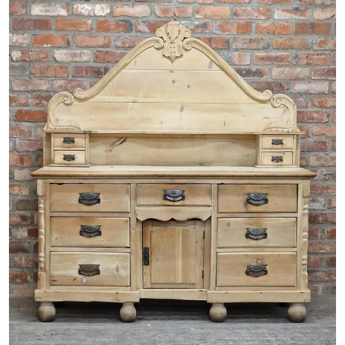 2410 - Victorian pine dresser with shaped back fitted with an arrangement of eleven drawers and central cup... 