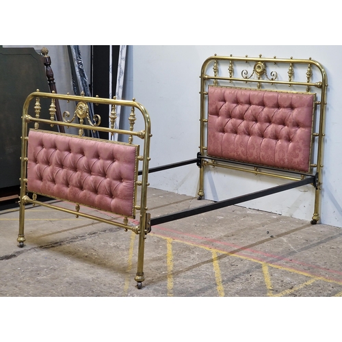 2426 - Victorian brass bedstead with iron side rails, cushioned head and footboard, studded edging, raised ... 