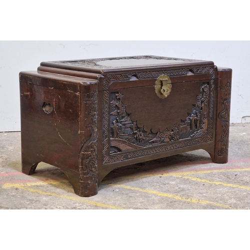 2427 - Oriental carved camphor wood blanket box with brass hinged lock, H 56cm x W 101cm x D 54cm