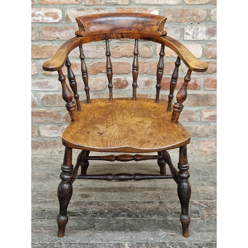 2359 - Antique elm and beechwood smokers bow elbow chair with saddle shaped seat, H 83cm x W 64cm