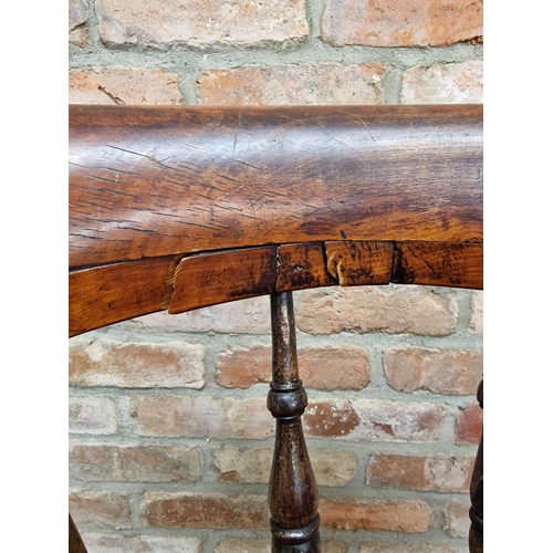 2359 - Antique elm and beechwood smokers bow elbow chair with saddle shaped seat, H 83cm x W 64cm