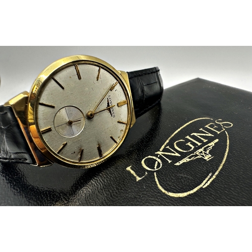 1041 - 1970s Vintage Longines 14k dress watch, 32mm case, champagne dial with gilt markers and subsidiary s... 