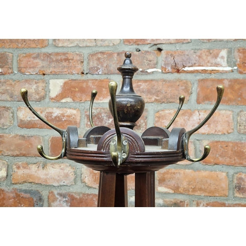 2423 - Victorian oak hall stand with brass hooks and three moulded supports, on a circular base with squat ... 