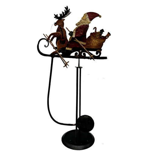 411 - Painted metal rocking toy of Santa and reindeer on a sleigh, 45cm high