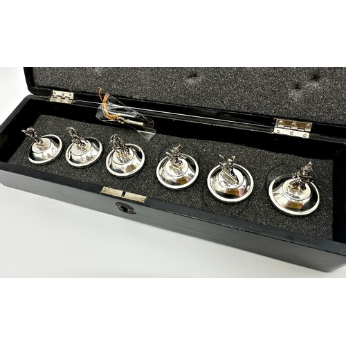 1165 - Cased set of six Siam sterling silver menu holders, each mounted by a theatrical character on weight... 