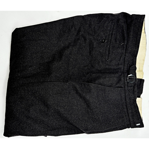 498 - A black wool suit by Pakeman Catto & Carter with a further pair of black wool trousers