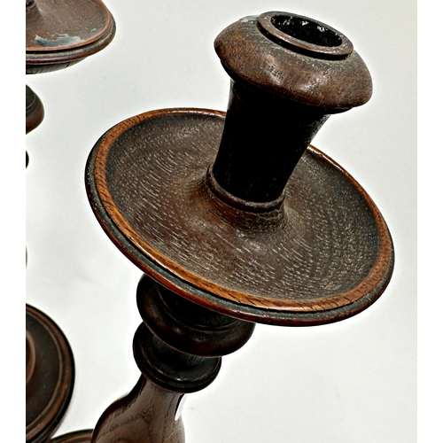 273 - Pair of 19th century turned oak baluster candlesticks, 35cm high (2)