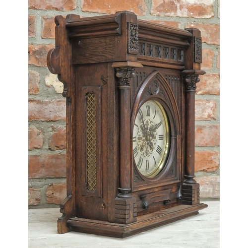 1060 - Arts and Crafts Gothic oak cased architectural mantle clock, two train brass dial with Gothic Roman ... 