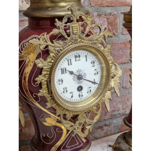 1061 - French Art Nouveau ceramic garniture mantle clock, with baluster shaped clock with twin brass handle... 