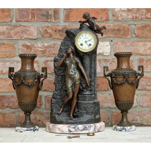 1062 - French bronzed spelter figural clock garniture, the clock modelled as a maiden stood at a pillar und... 