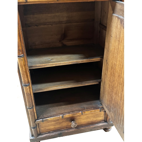 278 - French pitch pine apprentice Armoire, with bamboo frame, mirror door and single drawer, 55 x 32cm