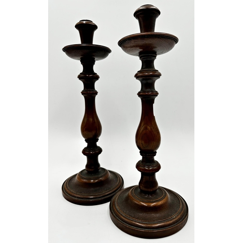 2284 - Pair of 19th century turned oak baluster candlesticks, 35cm high (2)