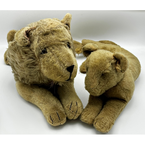 273 - Vintage straw stuffed recumbent lion, tail to head 603cm, with a similar lioness (2)