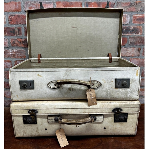 2421 - Matched pair of 1930s vellum suitcases, the largest 45 x 71cm