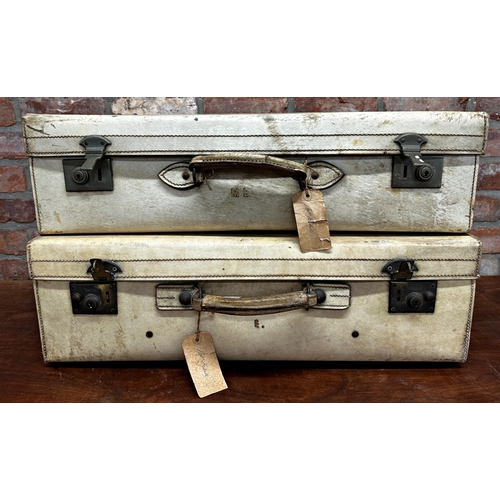 2421 - Matched pair of 1930s vellum suitcases, the largest 45 x 71cm