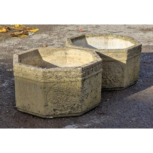 1003 - Pair of reconstituted Sandford stone octagonal planters with floral decoration, H 30cm x W 53cm, tog... 