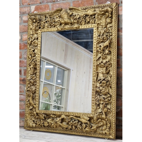 1055 - Good Antique Baroque giltwood wall mirror, carved with bird and flowers, 118 x 97cm (af)