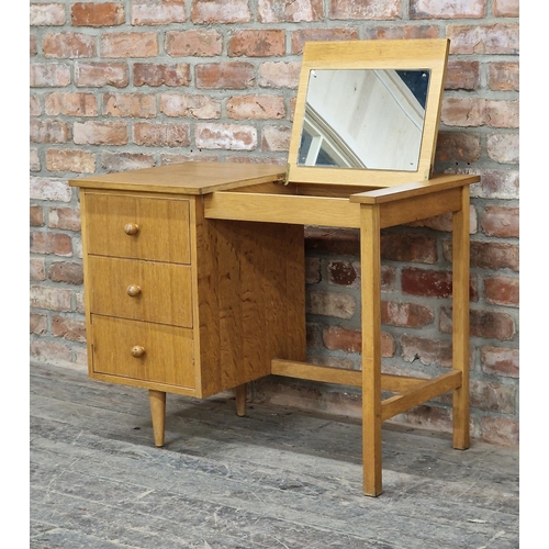 1142 - 1950s teak desk / dressing table, the hinged top with mirror to the reverse and three drawers, H 69c... 