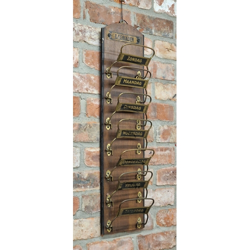 2329 - Novelty Dutch Newspaper rack, waterfall hinged brass brackets inscribed with a day of the week, 79cm... 