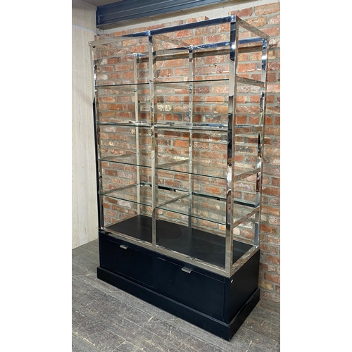 1208 - India Jane of London 'Soho' display unit, eight heavy glass shelves on a chrome frame with ebonised ... 