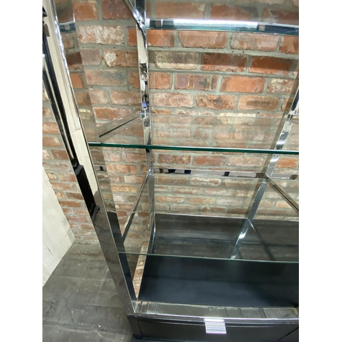 1208 - India Jane of London 'Soho' display unit, eight heavy glass shelves on a chrome frame with ebonised ... 