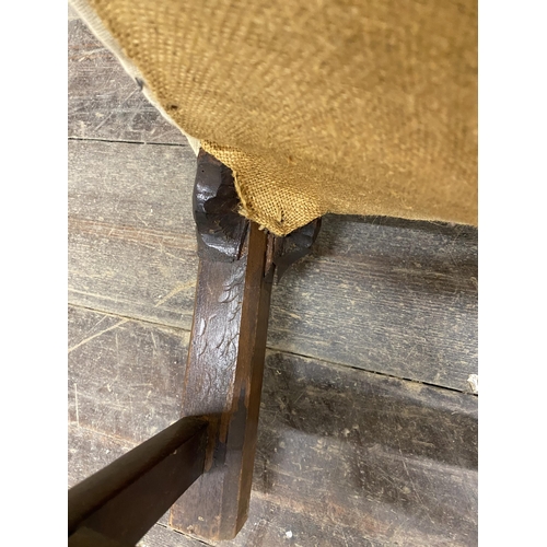 1245 - Period Howard style lounge chair, serpentine seat and back with hessian upholstery, carved and chamf... 