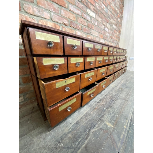 1275 - Incredible 19th century mahogany apothecary bank of drawers, comprising forty drawers in total each ... 