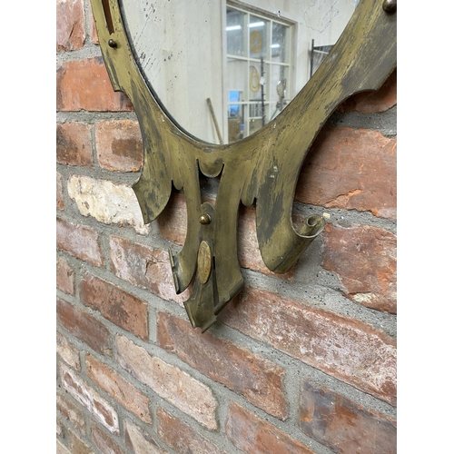 1061 - 19th century gilt metal eccentric wall mirror with shell and scroll decoration with original mercury... 