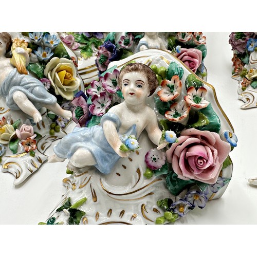 2191 - Set of six Sitzendorf porcelain wall brackets, with cherubs and bocage porcelain, each 12cm high, wi... 