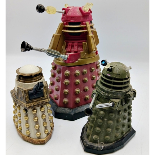 284 - Collection of multi-coloured plastic Dalek figures. Largest measures 22cm.