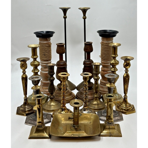 2381 - Large collection of wooden and brass candlesticks to include Barley Twist & Chamberstick Examples.