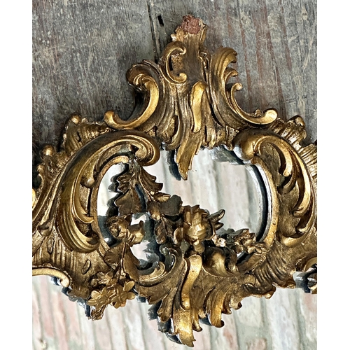 1073 - 19th century giltwood and gesso rococo wall mirror, 100 x 66cm