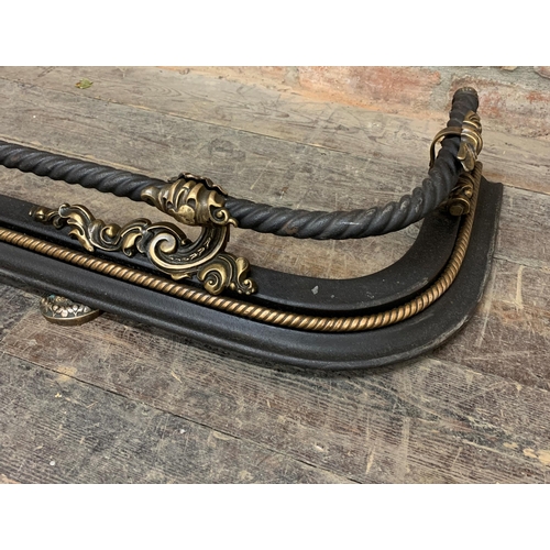 1287 - Good quality French cast metal twist rope design Fender with gilt metal detailing. W 150cm x D 36cm ... 